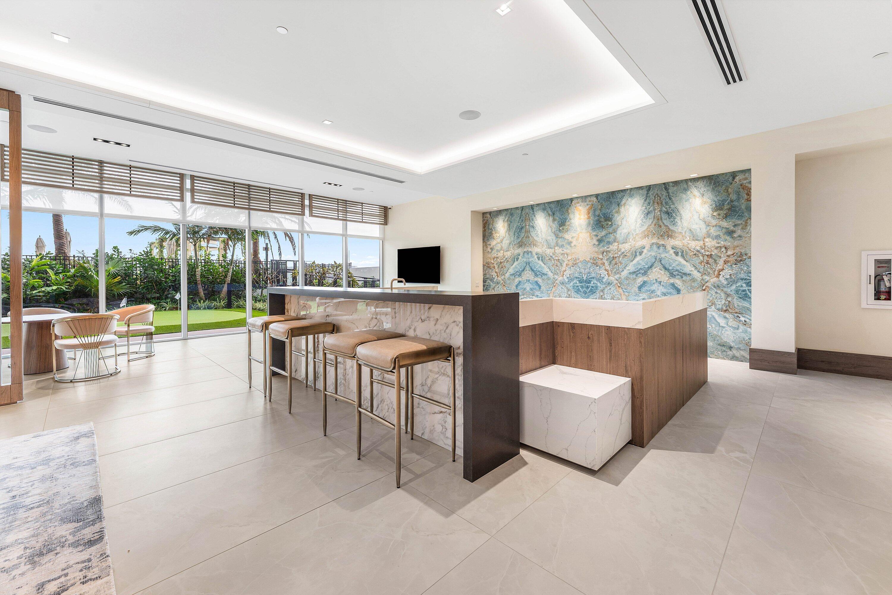 Resident clubroom bar with stone feature wall and garden access