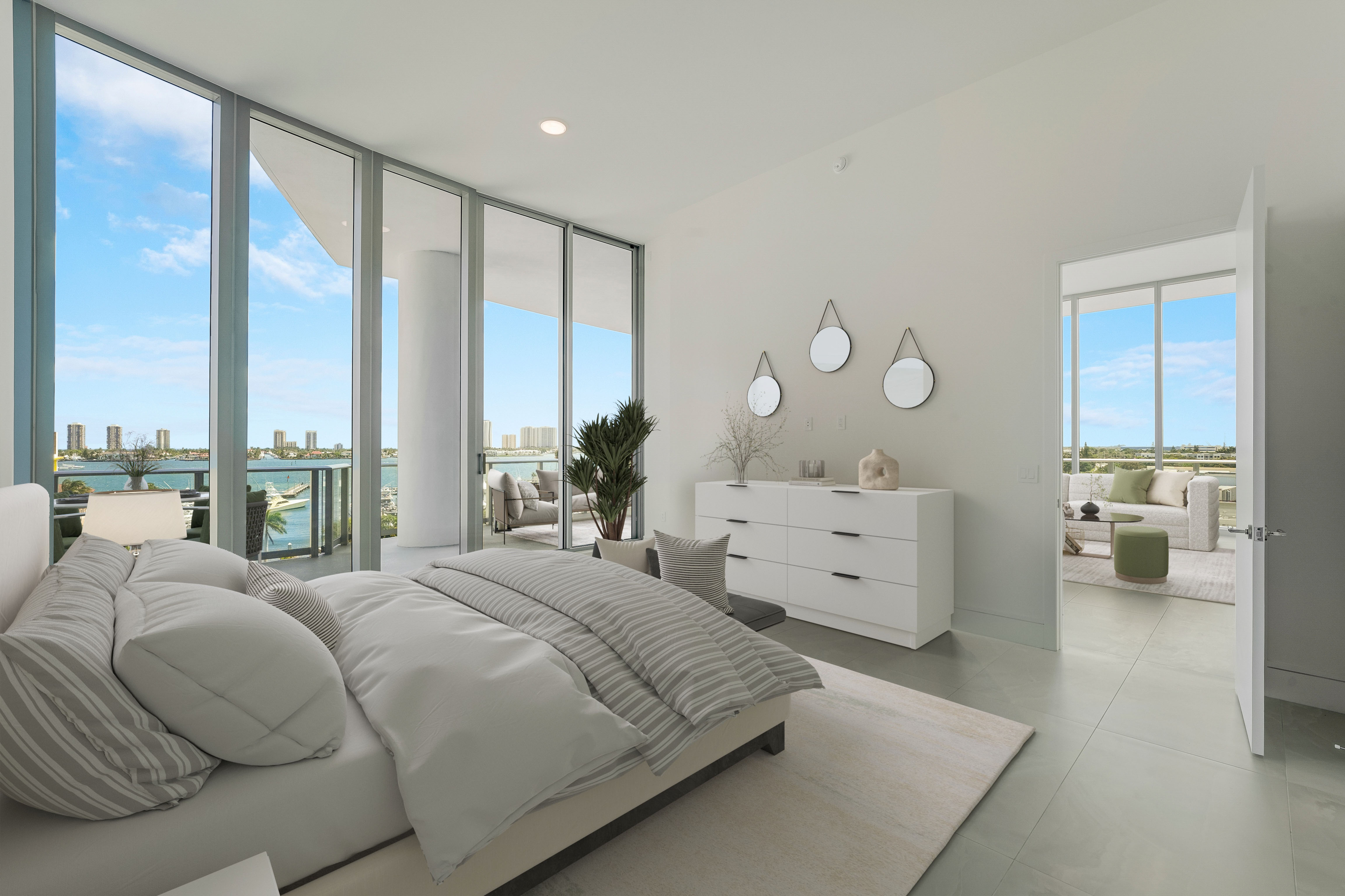 Virtually staged waterfront primary bedroom in Residence 612