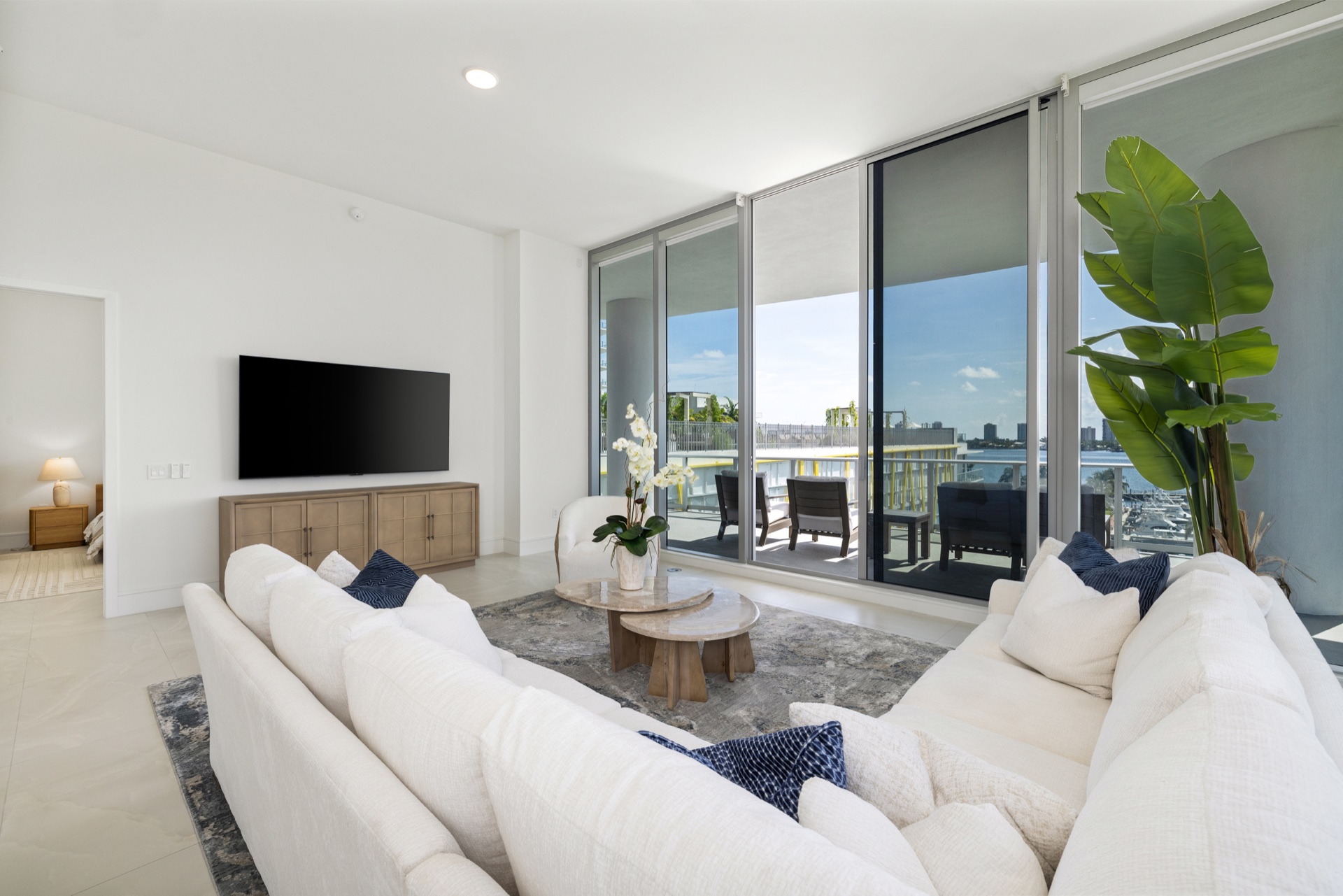 Fully furnished waterfront living room opening to the terrace in Nautilus 220 Residence 612