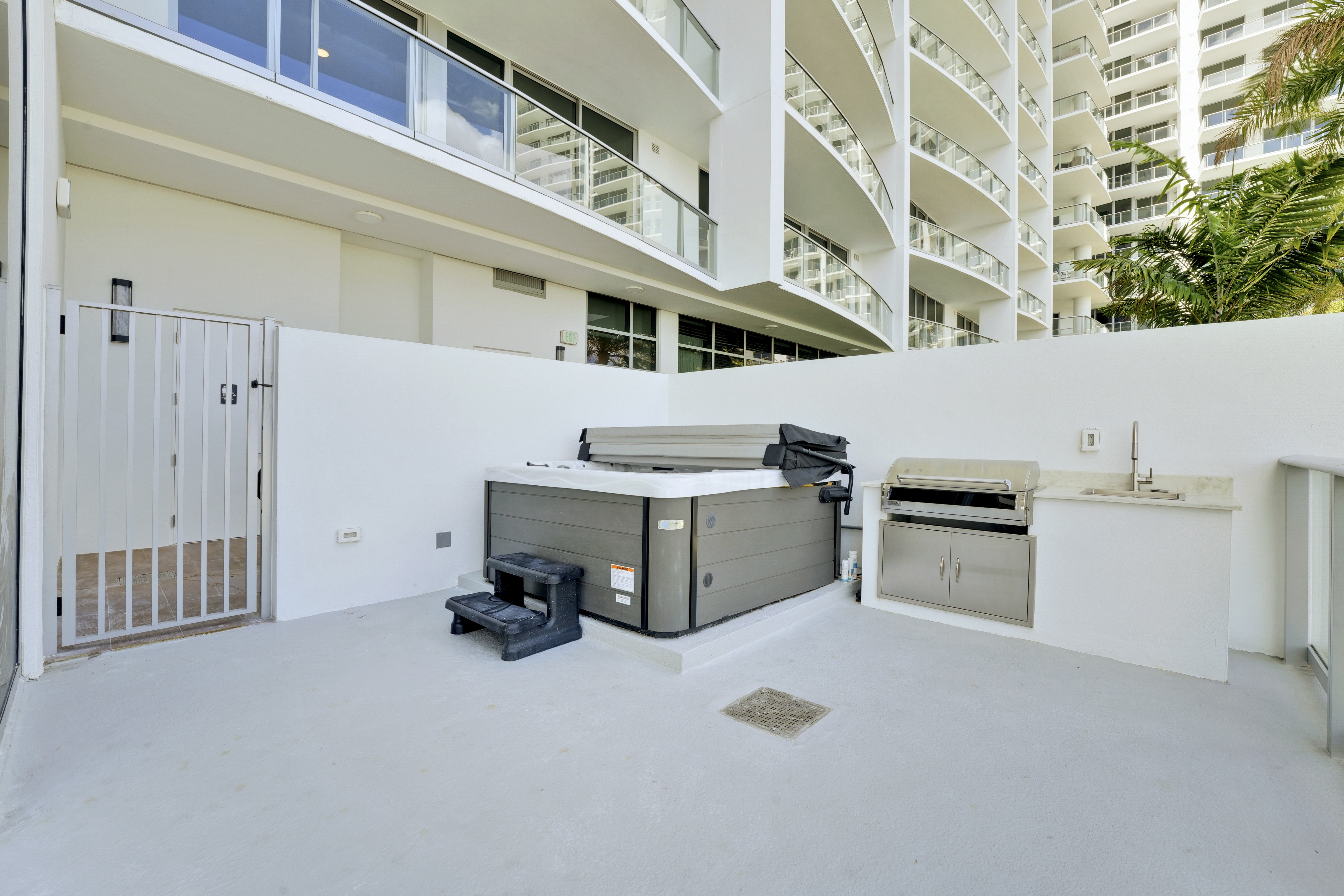 Private hot tub, outdoor kitchen and amenity-deck gate exclusive to Residence 612