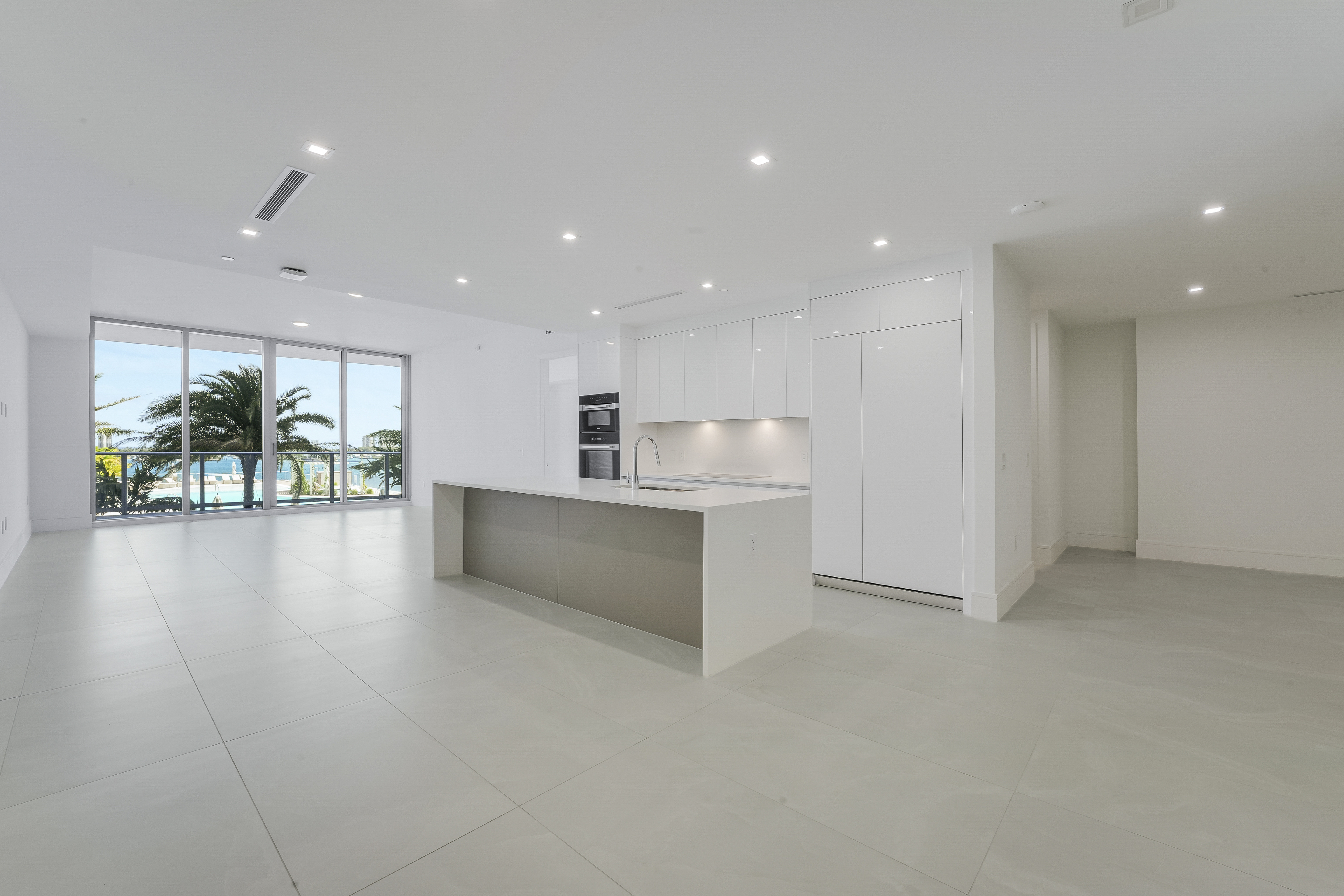 Actual great room and kitchen in Executive 704 overlooking the resort pool