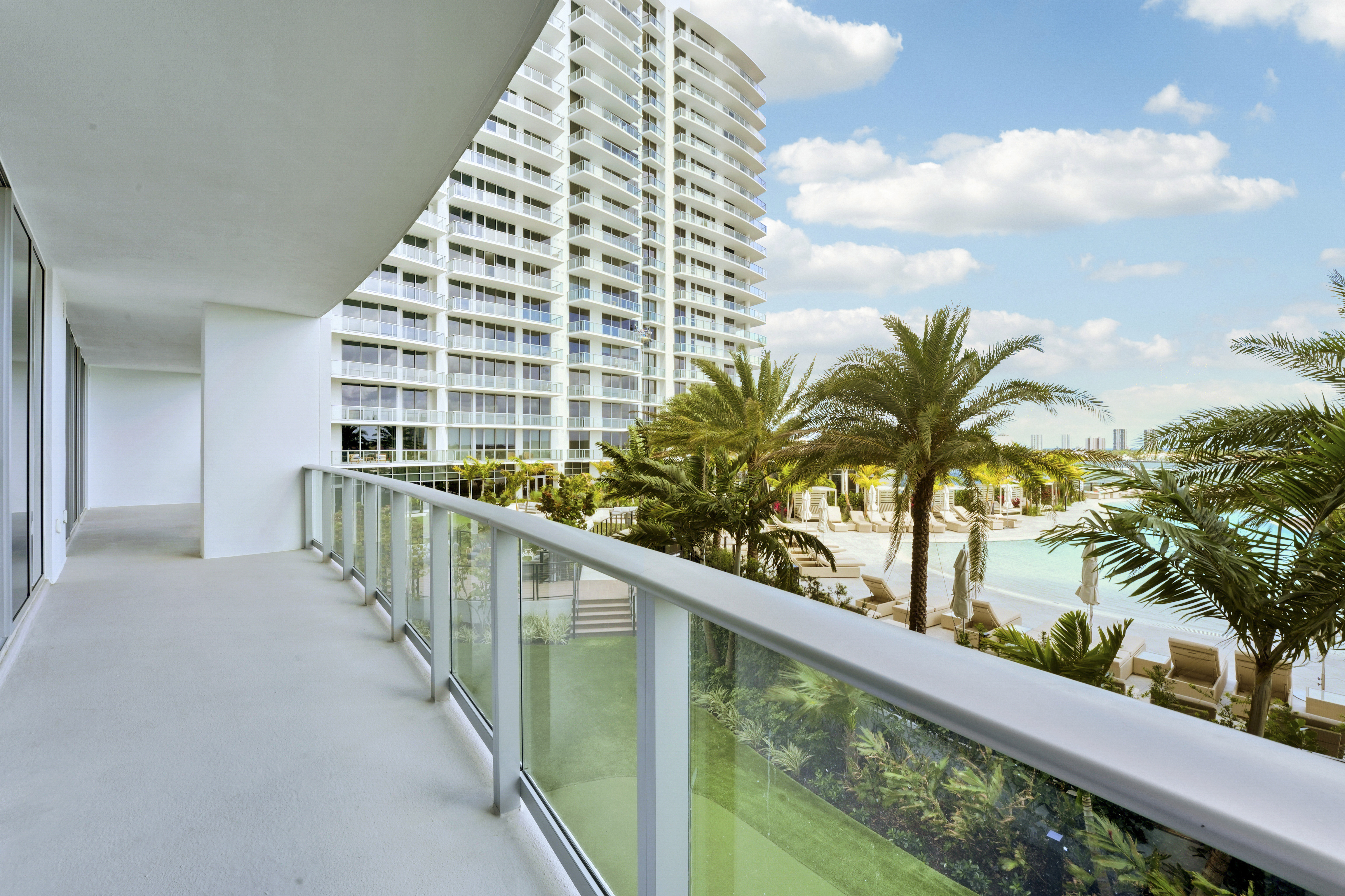 Long private terrace at Executive 704 overlooking the resort pool